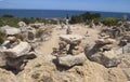 Girl walking next to Stone mounts in the south coast of the island of majorca