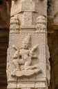 Stone mural sculpture on pillar at Kadelekalu Ganesha temple, Hampi, Karnataka, India