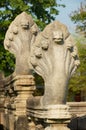 Stone nagas guarding the ruins of the Hindu temple in the Phimai Historical Park in Nakhon Ratchasima, Thailand. Royalty Free Stock Photo