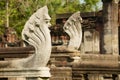 Stone nagas guarding the ruins of the Hindu temple in the Phimai Historical Park in Nakhon Ratchasima, Thailand. Royalty Free Stock Photo