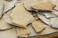 Stone natural flagstone piled in a pile. Natural stone flagstone, laid in uneven rows. Background .