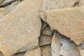 Stone natural flagstone piled in a pile. Natural stone flagstone, laid in uneven rows. Background .