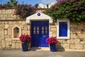 Stone old building house with blue wooden vintage door and windows. Bodrum, Turkey