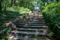 Stone old neglected stairs in the forest. Old path in the city park Royalty Free Stock Photo