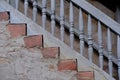 stone old staircase with railings and balusters, vintage texture of wall of medieval castle built in middle of 14th century, grey