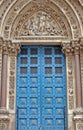 stone ornamental carved doorway , blue door