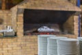 stone oven in the restaurant. Outdoor restaurant with stone stove. Brick oven for baking bread. A traditional oven for cooking and Royalty Free Stock Photo