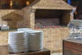 stone oven in the restaurant. Outdoor restaurant with stone stove. Brick oven for baking bread. A traditional oven for cooking and Royalty Free Stock Photo