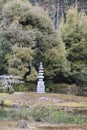 Stone pagoda Hakuja-cho, or White Snake Mound Kinkakuji complex and garden in February, Kyoto Japan Royalty Free Stock Photo