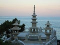 Stone Pagoda and Stone Lanterns Against Evening Sea and Sky, Haedong Yonggung Temple in Busan Royalty Free Stock Photo