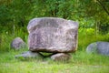 Stone parallelepiped on an improvised pedestal