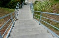 stone park long staircase with short platforms. of paved granite paving blocks. Royalty Free Stock Photo