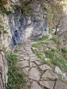 a stone path cuts through the side of a large hill Royalty Free Stock Photo