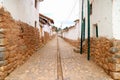 Stone path among the Old Stone Masonry Buildings of Chinchero, the Andean village in Sacred Valley of the Incas, Cuzco, Peru Royalty Free Stock Photo