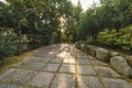 Stone path surrounded by trees in Chinese traditional garden Royalty Free Stock Photo