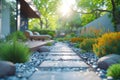 A stone path winds through the garden, leading to stairs Royalty Free Stock Photo