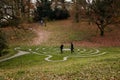 Stone pathway round outdoor prayer labyrinth in a circular shape, Ornamental garden with maze viewed slightly from above. Loucen Royalty Free Stock Photo