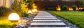 Stone Pathway With Solar Powered Garden Lights At Sunset, Back Yard Landscape Decoration Royalty Free Stock Photo
