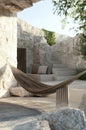 Modern Hammock and Outdoor Lounge Area with Stone Architecture Royalty Free Stock Photo
