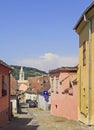 Stone paved old street with colorful houses in Sighisoara fortress Royalty Free Stock Photo