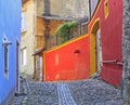 Stone paved old street with colorful houses in Sighisoara fortress Royalty Free Stock Photo