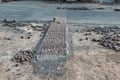 Stone pavement, construction worker laying cobblestone rocks on sand Royalty Free Stock Photo