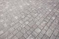 Stone pavement in perspective. Stone pavement texture. Granite cobblestoned pavement background. Abstract background of