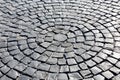 Stone pavement in perspective, texture of cobblestone road, gray cobbled road background Royalty Free Stock Photo