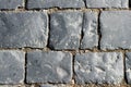 Stone pavement texture, granite cobblestoned pavement background, cobbled stone road regular shapes, abstract background Royalty Free Stock Photo