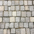 Stone pavement texture. Granite cobblestoned pavement background. Abstract background of old cobblestone pavement close-up. Seamle Royalty Free Stock Photo