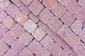 Stone paving stones for garden paths and sidewalks. Background from red squares. Texture of red square stone tiles. Paving paths Royalty Free Stock Photo