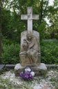 Stone pedestal of the statue of tombstones in the old cemetery. tomb sculpture monument to the mother of the mourner and cross. Royalty Free Stock Photo