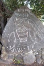 Stone with a picture of loaves and fish in front of the Church of the Multiplication in Tabgha Royalty Free Stock Photo