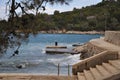 Stone pier with rusty bollard. Completely rusted dilapidated iron mooring bollard in middle of stone pier. Royalty Free Stock Photo