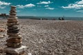 A stone pile on the sea beach. Stone tower closeup. Royalty Free Stock Photo