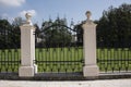 Stone pillar and decorative wrought iron fence gate Royalty Free Stock Photo