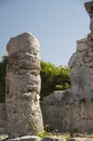 Stone pillar at ruins of Tulum Mayan temple Royalty Free Stock Photo