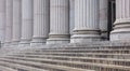 Stone pillars row and stairs detail. Classical building facade Royalty Free Stock Photo