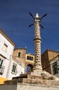 Stone pillory in front of Santa Clara archway at Elvas, Portugal Royalty Free Stock Photo