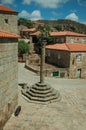 Stone pillory in square encircled by gothic houses Royalty Free Stock Photo