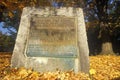 Stone and plaque marking founding of Windsor, VT in autumn