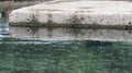 Stone platform in pond at park