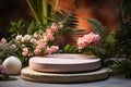 Stone product display podium for natural product. Circular shape base. Plants and pink flowers