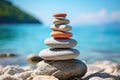 Stone pyramid. Pebbles balance pile, harmony zen stones, balance stack, sea pebble pyramid on shoreline, relaxation