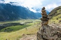 Stone pyramid in river valley Chulyshman. Natural landscape Republic Altai, Russia, summer day. mountain in clouds Royalty Free Stock Photo