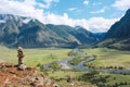 Stone pyramid in river valley Chulyshman. Natural landscape Republic Altai, Russia, summer sunny day. mountain in clouds Royalty Free Stock Photo