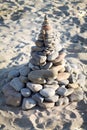 Stone pyramid on the sand Royalty Free Stock Photo