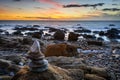 Stone pyramid and sunset at the beach