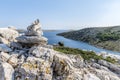 Stone pyramid on top of the mountain of the island of Lavsa of the Kornati archipelago in the Adriatic sea Royalty Free Stock Photo