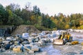 Stone quarry with limestone and a Wheel loader at autumn Royalty Free Stock Photo